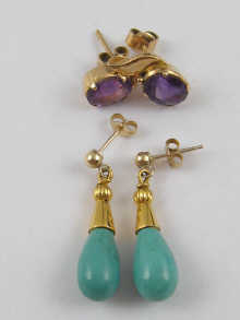 A pair of amethyst earrings set 14de27