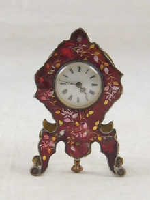 A small French clock with enamel dial