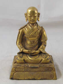 A gilt bronze figure of Buddha ht.15