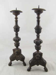A pair of bronze pricket candlesticks