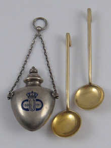 A pair of Russian silver gilt salt spoons