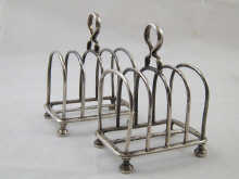 A pair of silver toast racks retailed