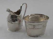 A hand raised Art and Crafts silver