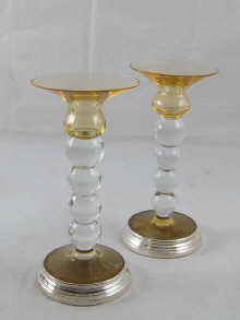 A pair of modern candlesticks the