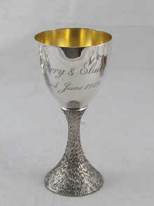 A modern silver goblet with textured 14defc