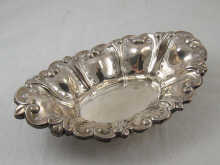 A silver pierced and lobed oval