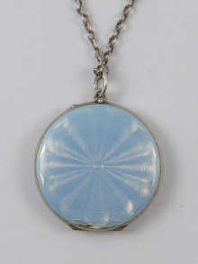 A blue guilloche enamelled silver locket