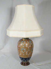 A table lamp formed from a Doulton vase