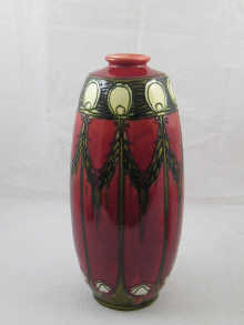 A tall vase of elongated barrel form