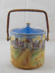 A ceramic biscuit barrel with lid and