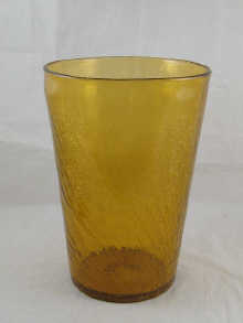 A large tapered amber glass vase with