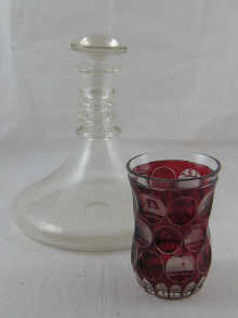 A glass beaker facet cut then ruby