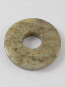 A Chinese carved nephrite disc 14dfa7