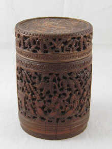 A large bamboo pot and cover deeply