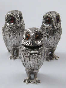 A silver cruet set of salt pepper and