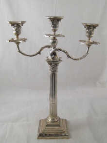 A silver three light candelabrum the