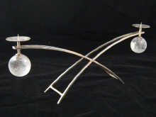 A stylish two arm sterling silver and