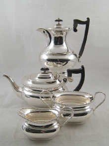 A Four piece silver plate barge