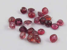 A quantity of loose polished red gemstones