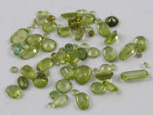 A quantity of loose polished peridots