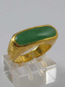 A jade and yellow metal (tests