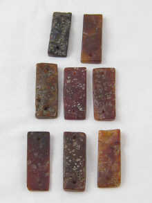 Eight carved and pierced agate tablets