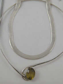 A white metal (tests silver) gem set