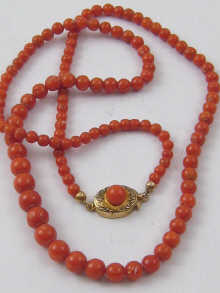 A graduated coral bead necklace