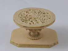 A carved Chinese small stand in