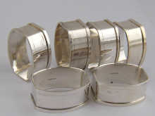 A set of six silver napkin rings of