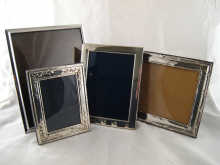 Four modern silver photo frames