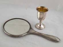 A silver backed hand mirror Chester