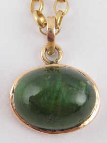 A 9 carat gold cabochon tourmaline