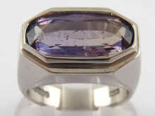 A platinum and alexandrite ring