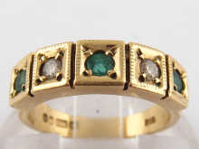 A 9 carat gold five stone emerald and