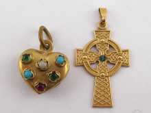 A 9 carat gold cross pendant and a 9