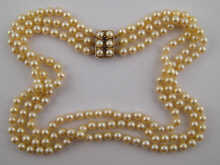 A three row cultured pearl necklace 14e156