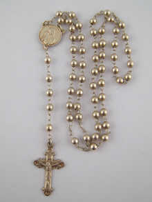 A white metal (tests silver) rosary