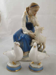 A Russian ceramic group of a young girl