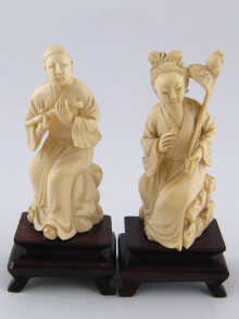 A pair of Chinese ivory figures the