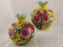 A pair of ceramic vases in the shape