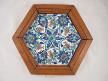 A hexagonal Iznik tile with traditional