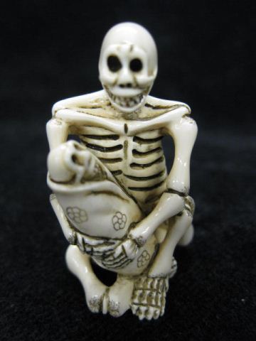 Carved Ivory Netsuke of a Skeletonholding 14e6ad