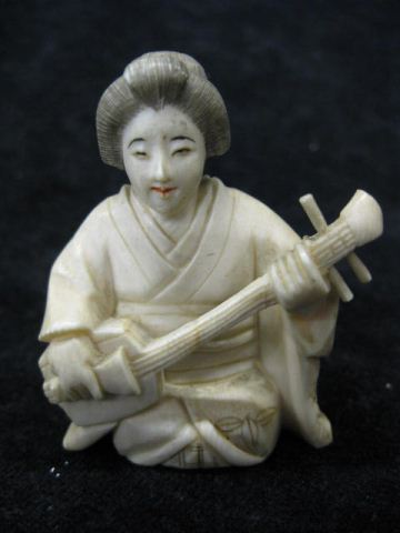 Carved Ivory Figurine of Seated 14e736