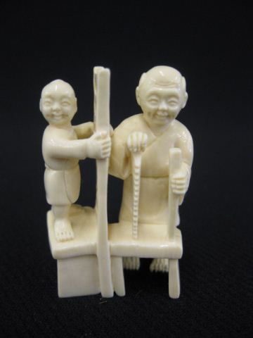 Carved Ivory Netsuke of a Carpenter