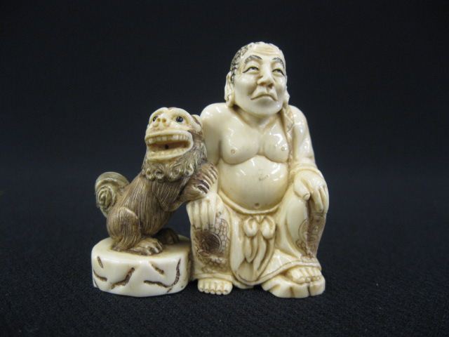 Carved Ivory Netsuke of a Seated