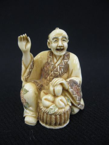 Carved Ivory Netsuke of a Seated 14c109