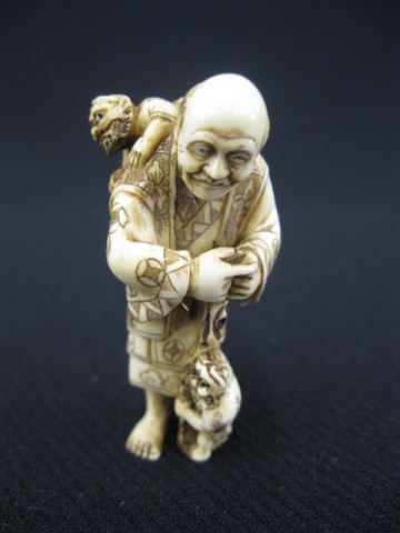 Carved Ivory Netsuke man with two 14c191