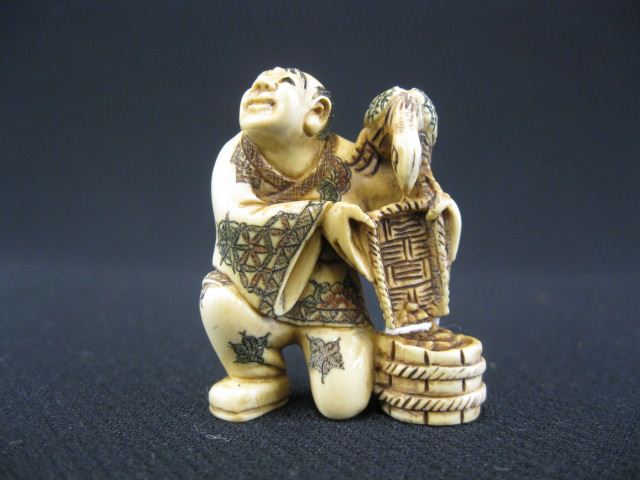 Carved Ivory Netsuke man with bird 14c1ab