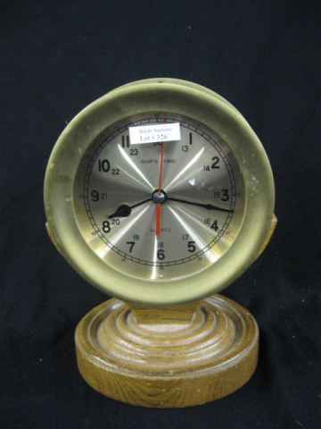 Ships Clock brass on wooden pedestalholder